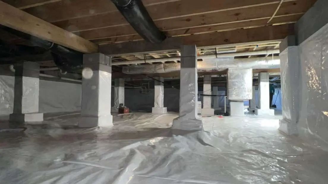 Crawl space vapor barrier installation