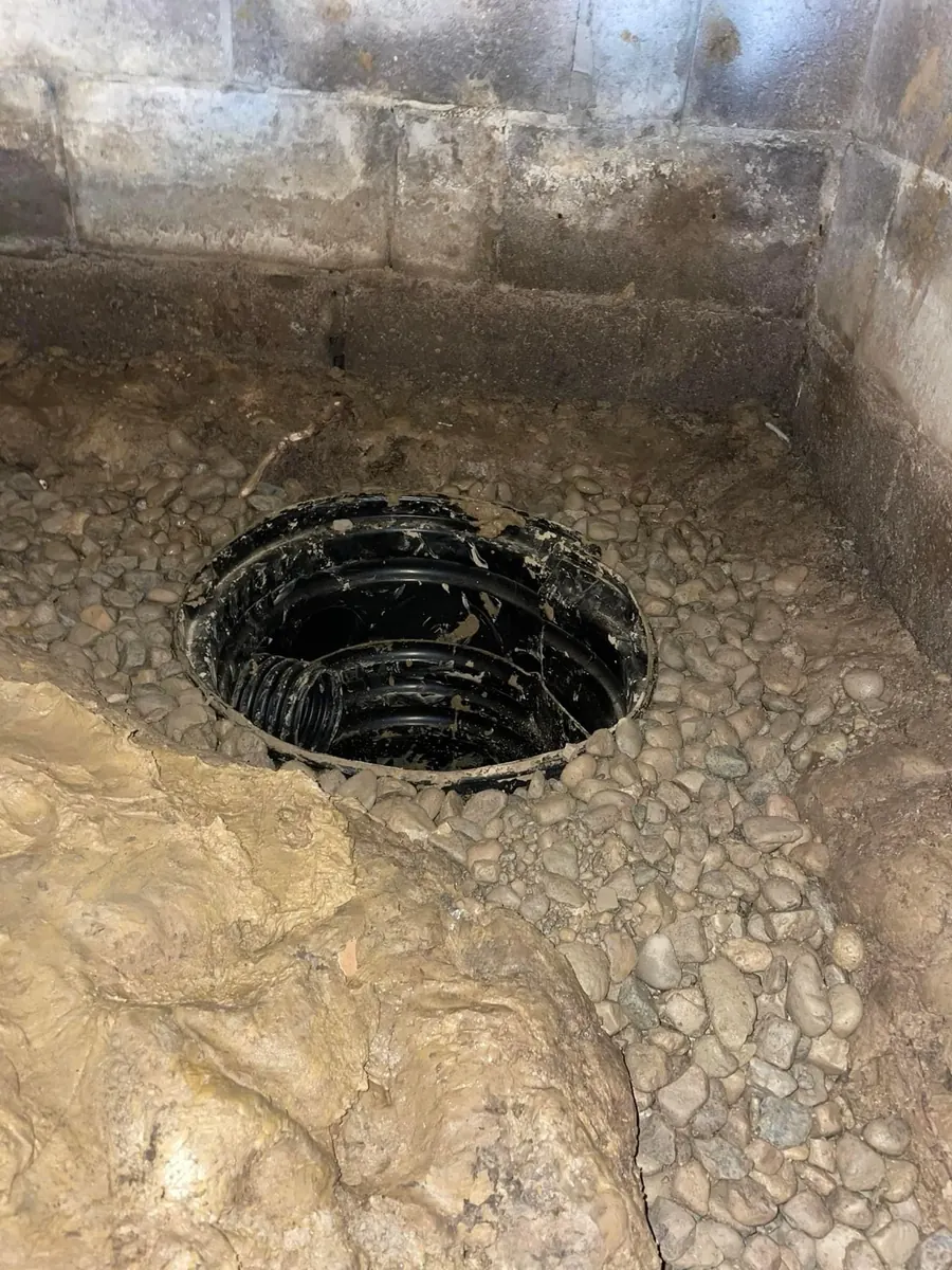 Sump and drainage detail in a basement waterproofing project